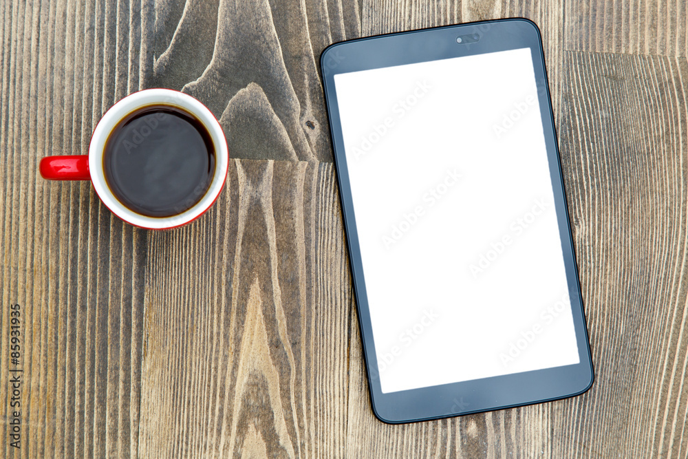 digital tablet and coffee cup on wooden table digital tablet and coffee cup on wooden table