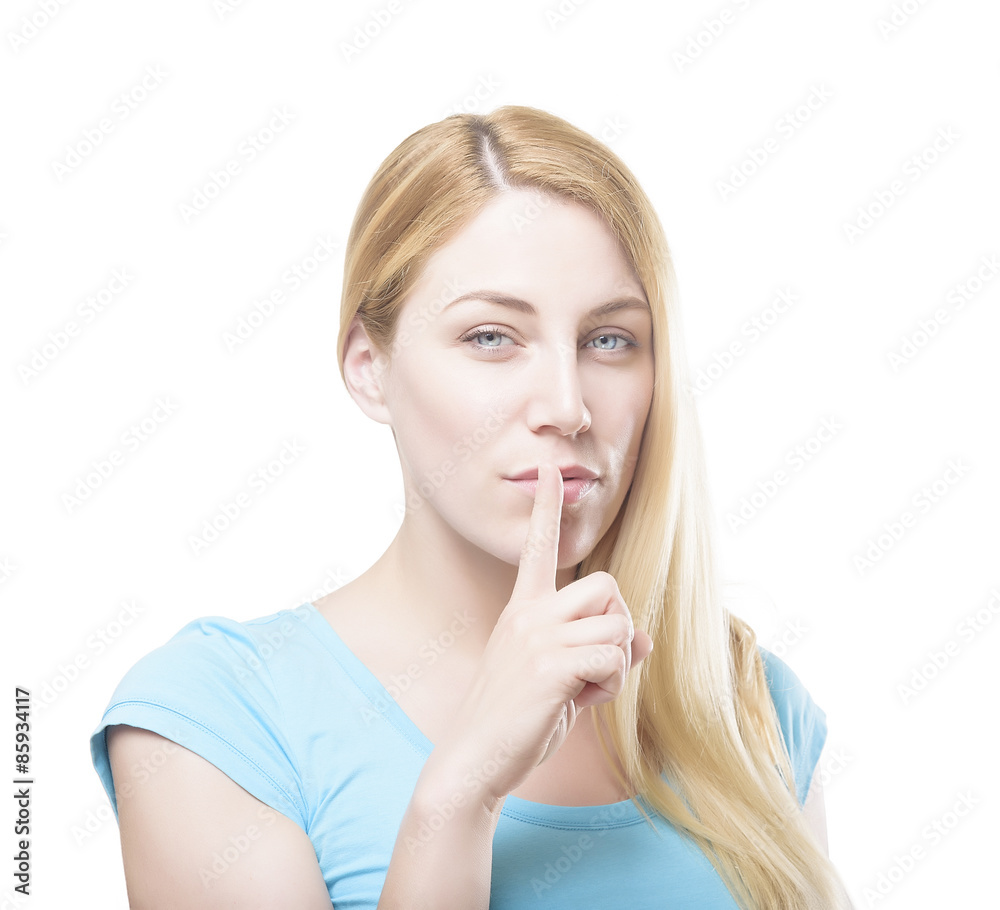 Blonde holding a finger to her mouth. Blonde holding a finger to her mouth.