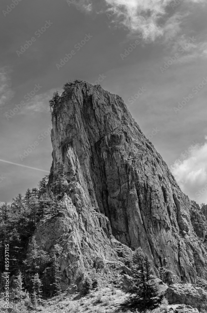 landscape of a bare mountain peak during summer on italian alps. black and white