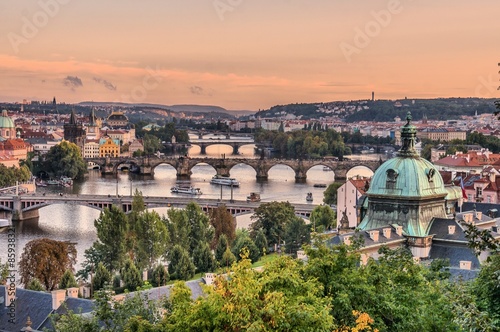 Bridges over Vltava river in Prague at evening during sunset