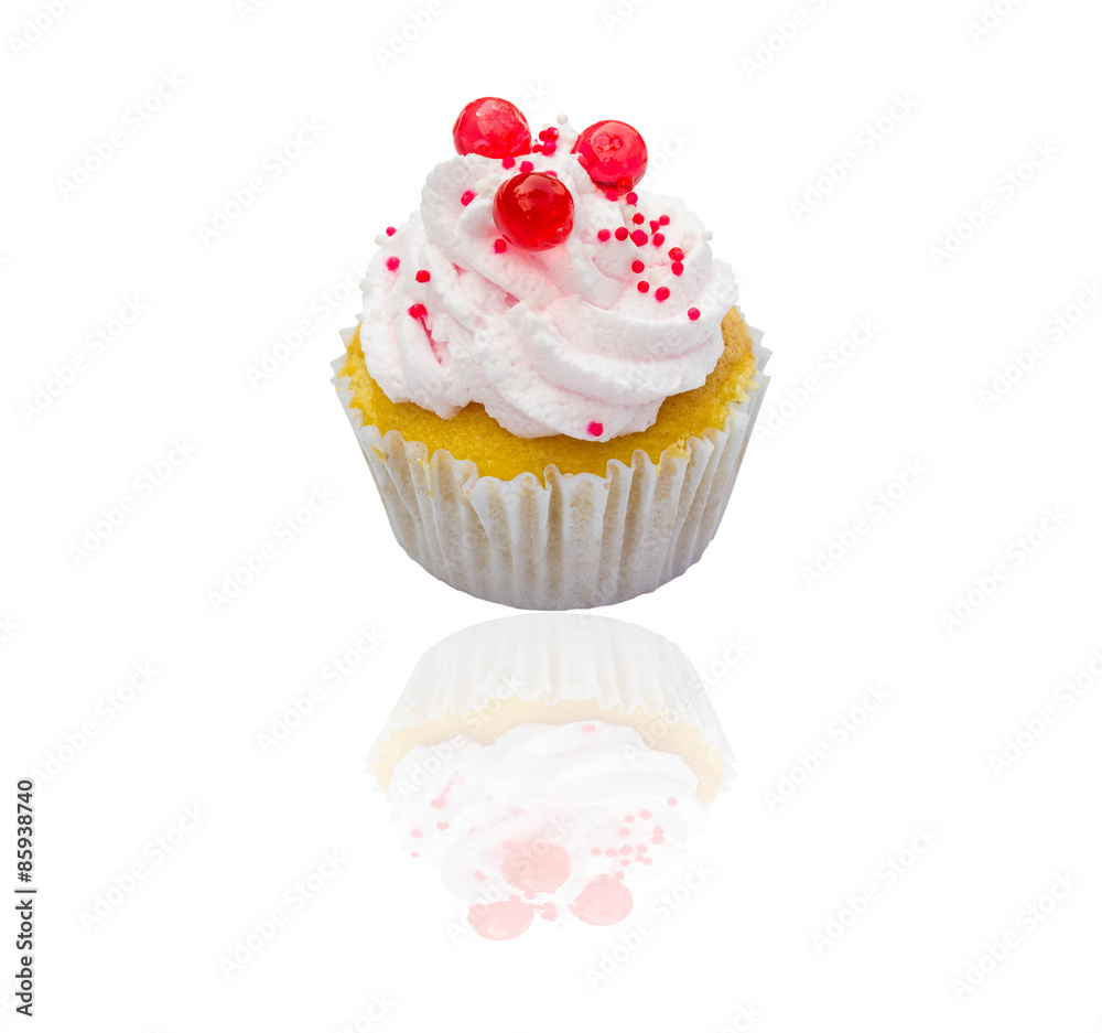 Cupcake with whipped cream and  isolated on white