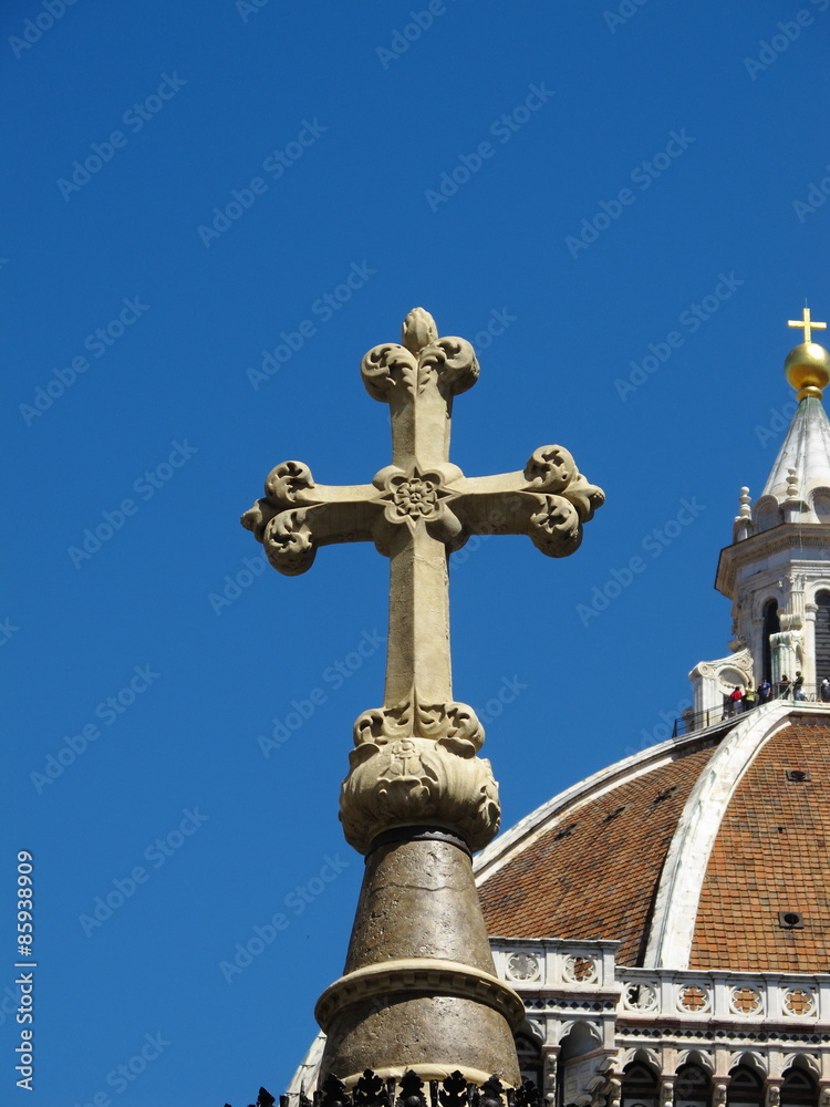 Christian cross with Basilica in background