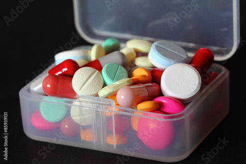 Overflowing pillbox closeup