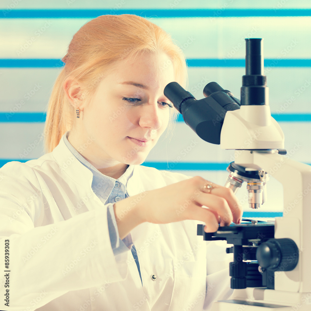 technician in the laboratory using a microscope technician in the laboratory using a microscope