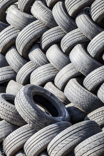 wheel tires of car stacked orderly, rubbber tire background, rou photo