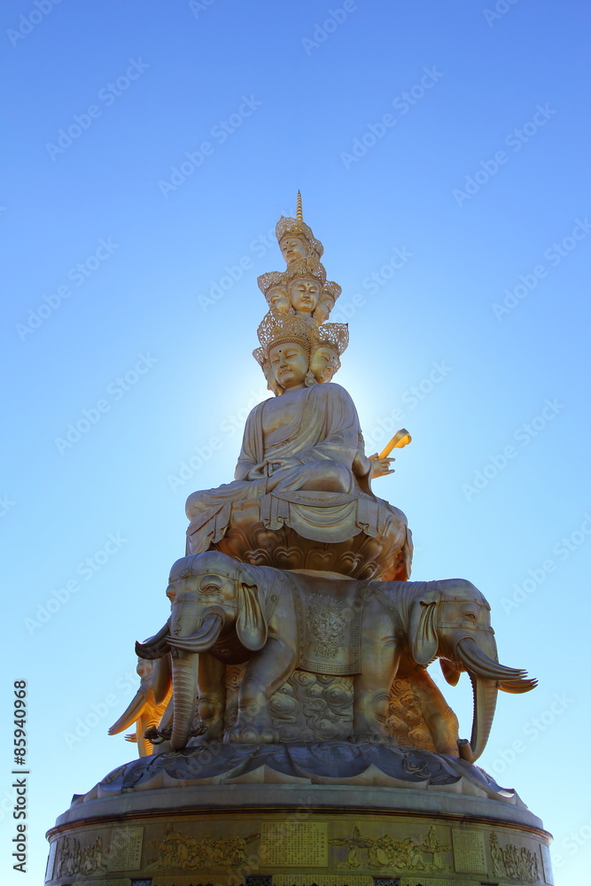 Samantabhadra statue with sun behind