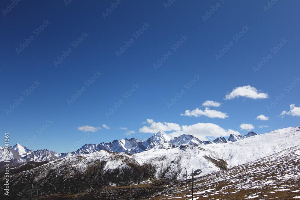 Snowcapped mountain with clear skies