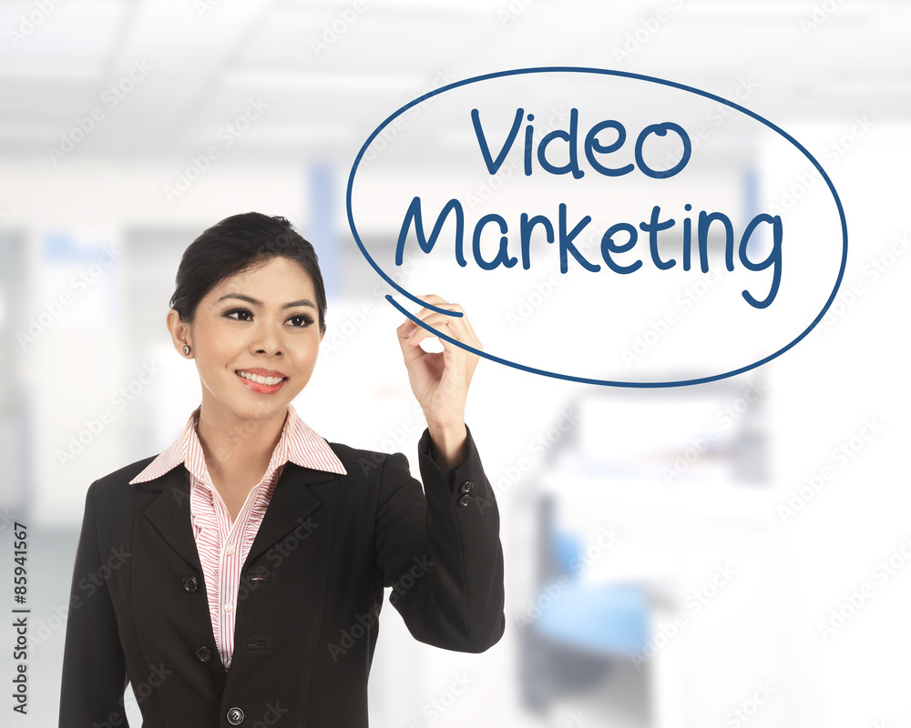 Asian business woman writing video marketing Asian business woman writing video marketing