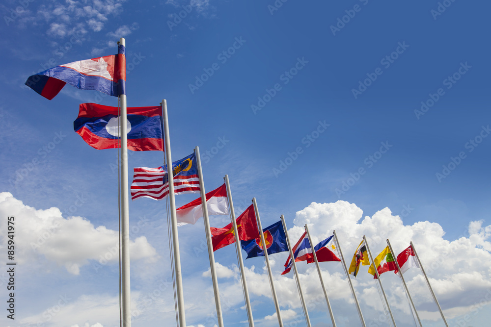 AEC flag, ASEAN flag, and the national flags of Southeast Asia countries on beautiful blue sky backgrond