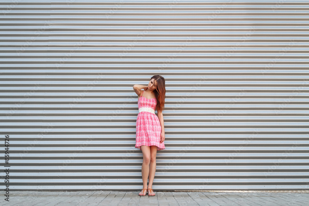 Portrait of a cute girl on a metal background Portrait of a cute girl on a metal background