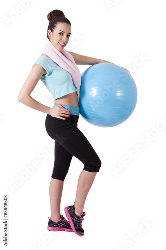 girl in the gym with ball and towel