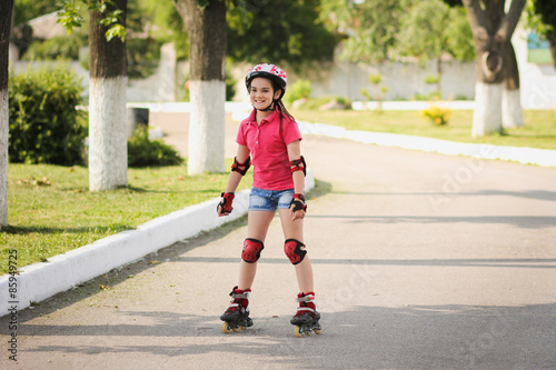 Girl rides on roller skates