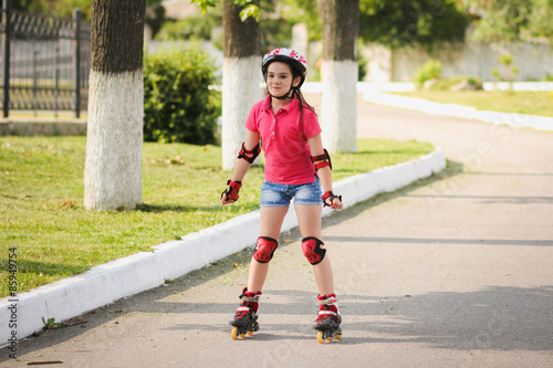 Girl rides on roller skates