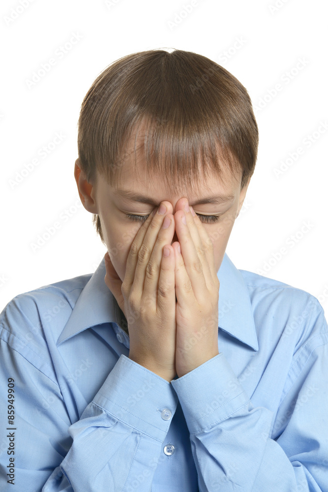Young man praying head bowed Young man praying head bowed