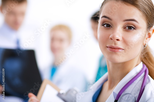 Woman doctor standing with stethoscope at hospital
