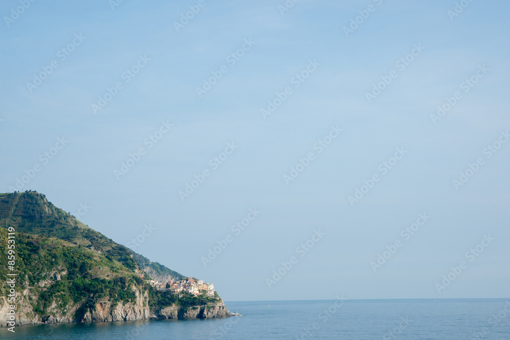 Riomaggiore small Italian coastal hillside fishing village on Mediterranean Sea. Riomaggiore small Italian coastal hillside fishing village on Mediterranean Sea.