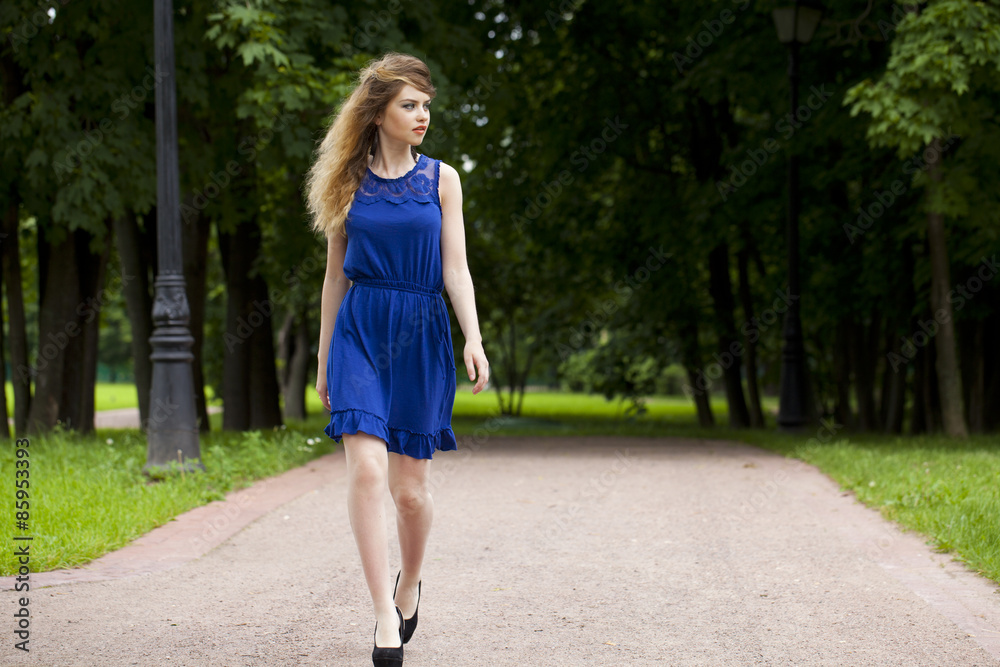 Beautiful young blonde woman in blue dress Beautiful young blonde woman in blue dress