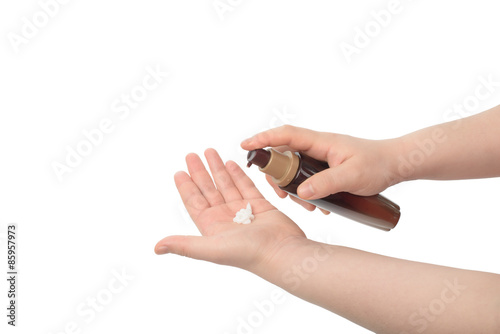 asian woman hand hold lotion photo