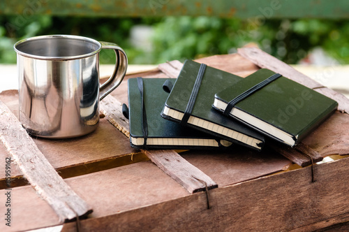 cup of coffee with notepads
