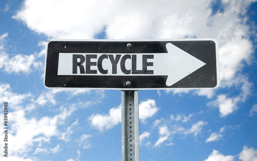 Recycle direction sign with sky background