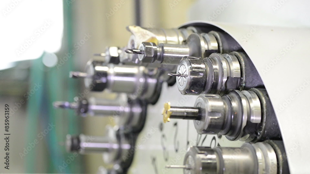 Automatic tool changer rotating bits with tools at CNC lathe milling center Automatic tool changer rotating bits with tools at CNC lathe milling center