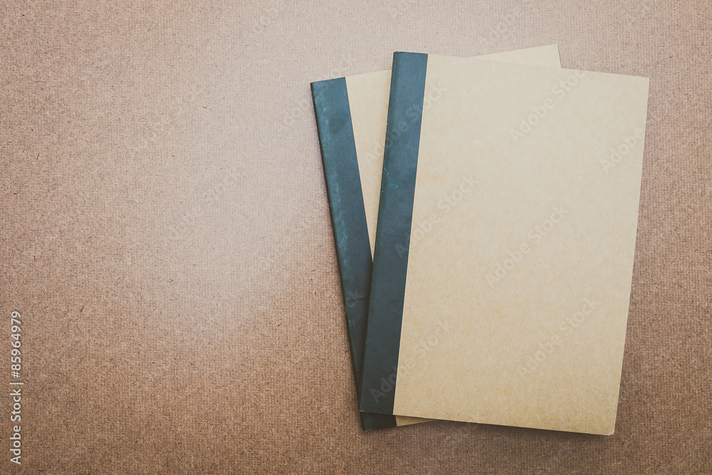 Fototapeta premium Notebook mock up on wood background
