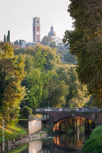 Retrone river and trees with the sanctuary of Mount Berico seen from Furo bridge, Vicenza photo