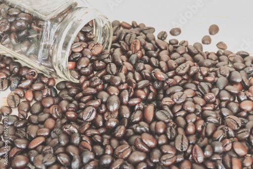 coffee beans and a jar, selective focus, process color with vint photo