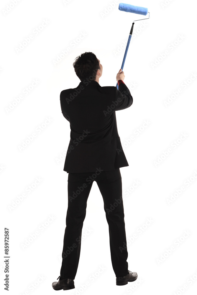 Man painting something with roller brush Man painting something with roller brush