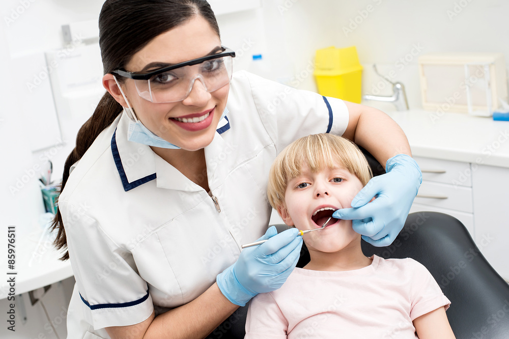 Child on her dental check up. Child on her dental check up.