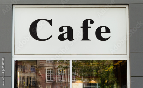 Cafe sign on the window of the restauran photo