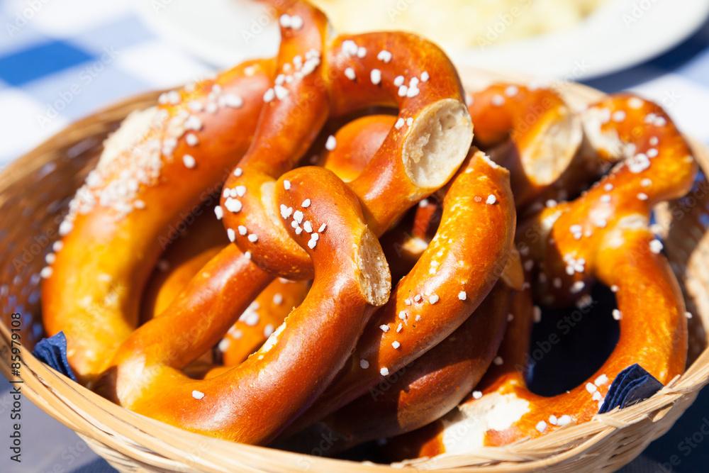 Basket with fresh bavarian pretzels with salt Basket with fresh bavarian pretzels with salt