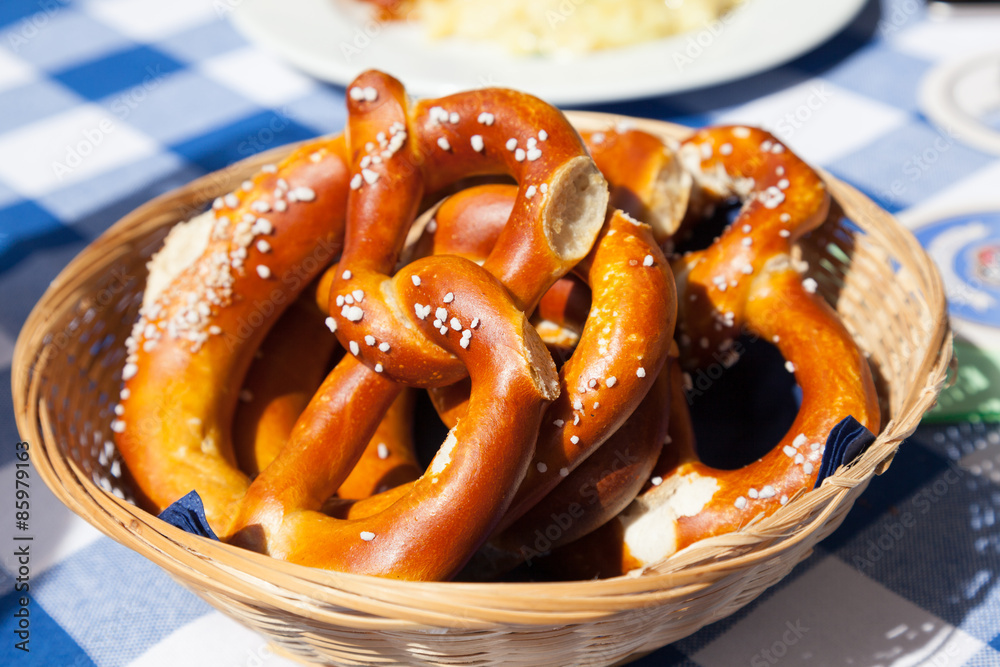 Basket with fresh bavarian pretzels with salt Basket with fresh bavarian pretzels with salt