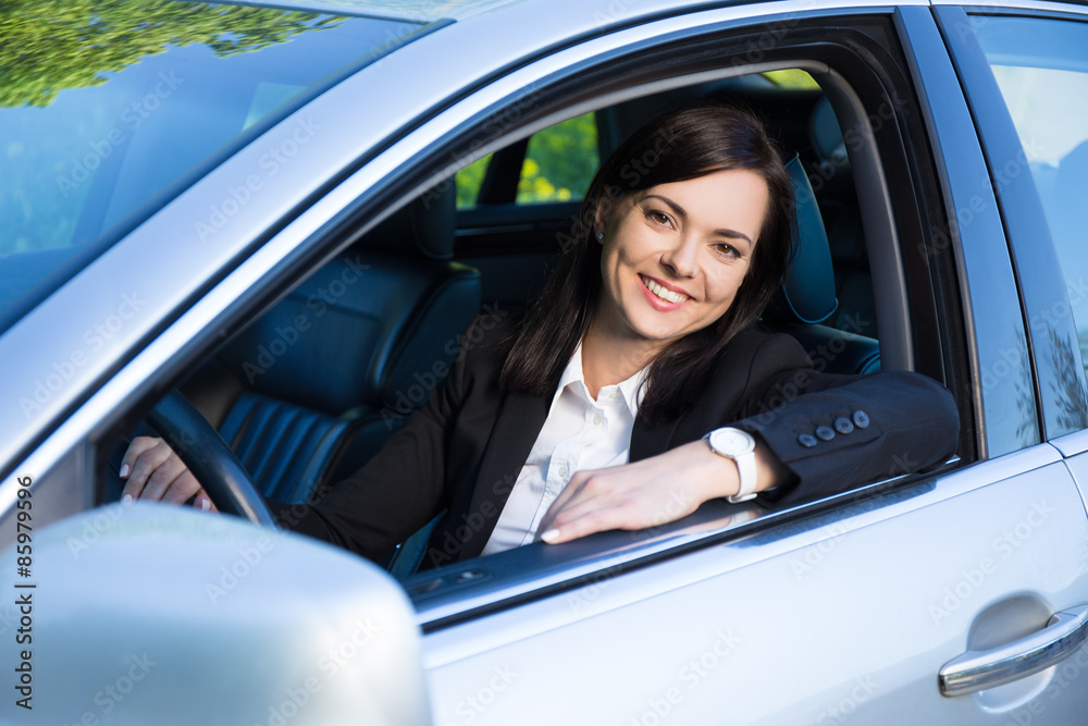 young business woman sitting in her car