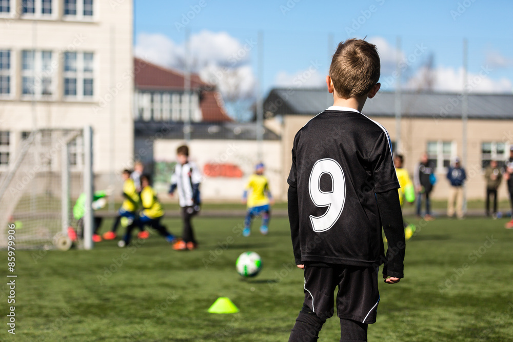 Fototapeta premium Young boy during soccer match