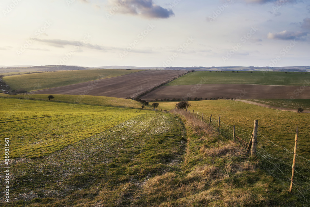 Fototapeta premium Beautiful Spring evening sunset light over fields landscape on f