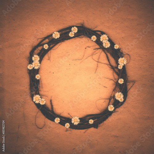 Floral Round Frame with daisies flowers and old paper background.