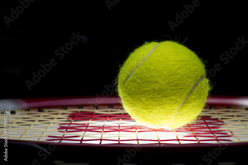 Tennis Ball on Racket © jiradet_ponari