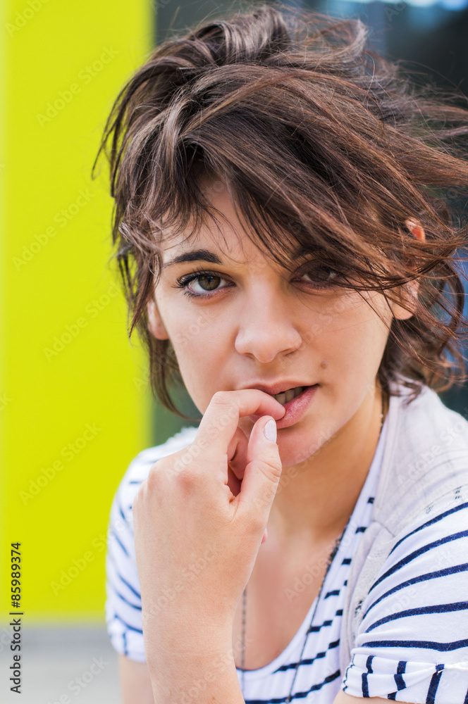 Young beautiful short hair woman in the city, close portrait Young beautiful short hair woman in the city, close portrait