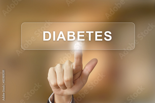 hand clicking diabetes button on blurred background