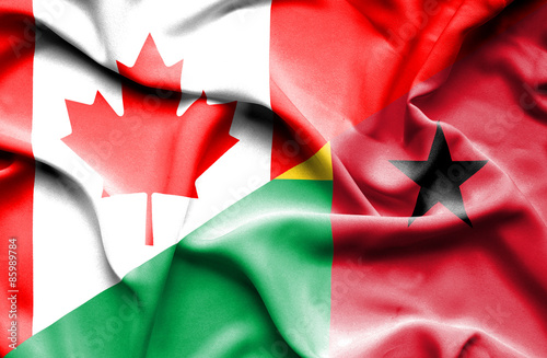 Waving flag of Guinea Bissau and Canada