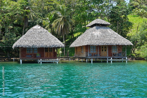 Tropical wooden bungalows over the water