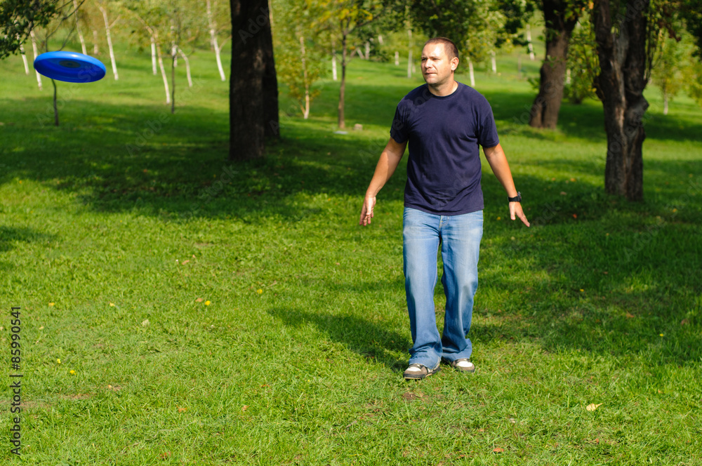 Young man playing frisbee Young man playing frisbee