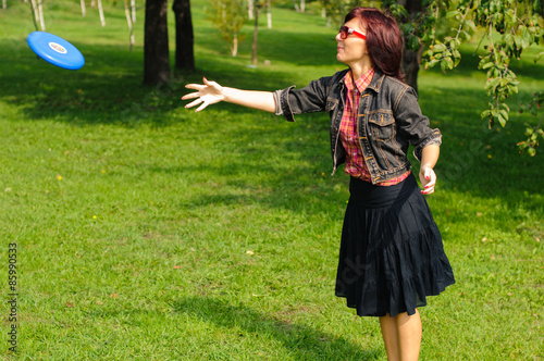 Young woman with frisbee