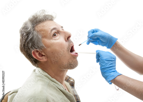 Nurse applying  iodine photo