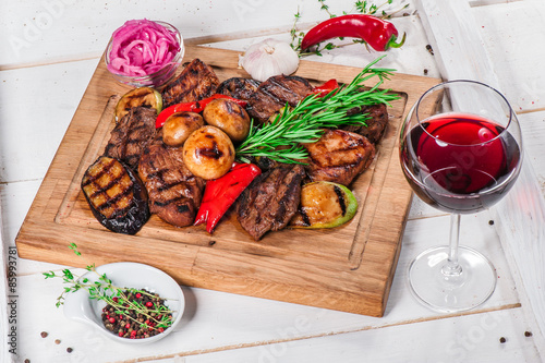 Grilled pieces of meat and different vegetables