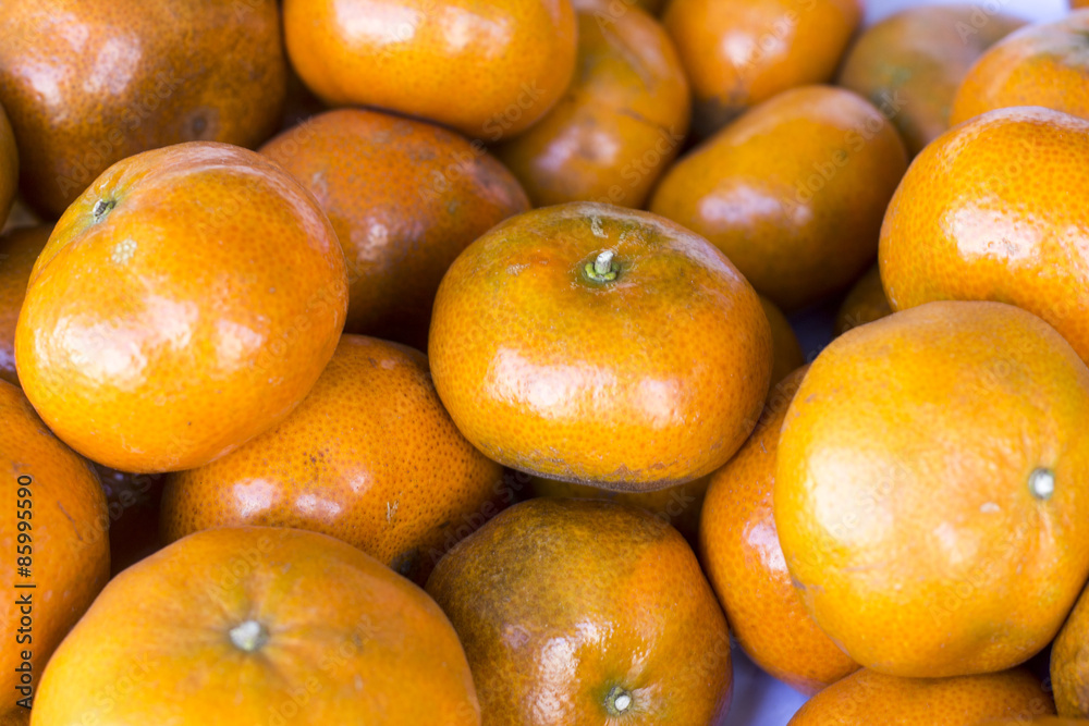 Lot of mandarin orange /Mandarin in a market in Peru Lot of mandarin orange /Mandarin in a market in Peru