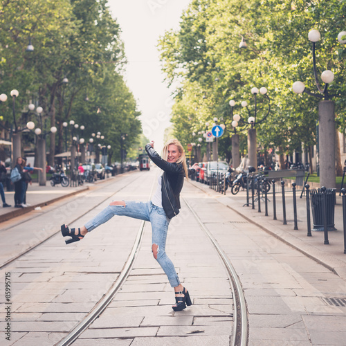 Beautiful girl posing in the city streets © tinx