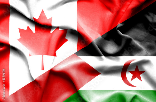 Waving flag of Western Sahara and Canada