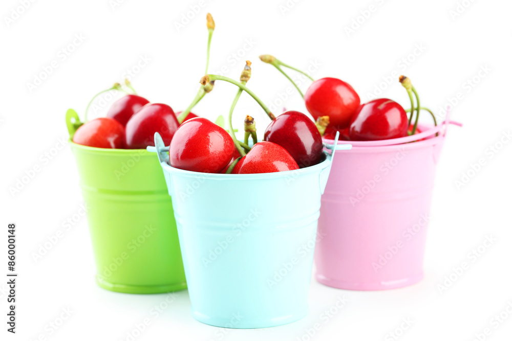 Ripe cherries in buckets isolated on white Ripe cherries in buckets isolated on white